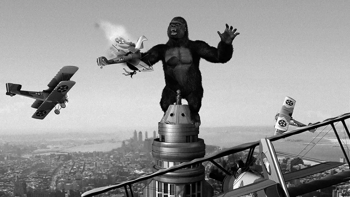 King Kong acosado por una escuadrilla de biplanos Curtiss F8C-5 Helldiver.